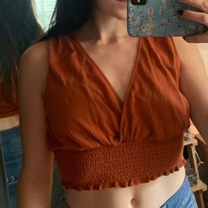 flowy, burnt orange, steep-neck crop top